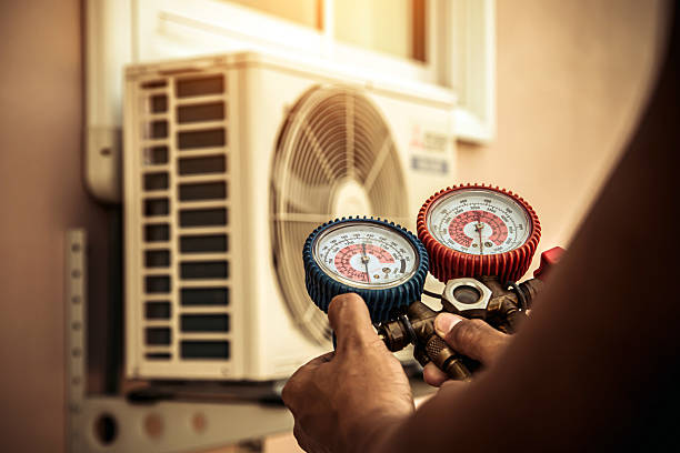 Professional Air Conditioning Service technician working in Clinton, AR